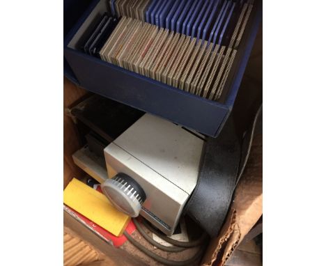 A box containing Rank Aldis slide projector and slides 