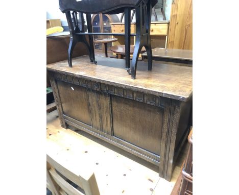 An oak bedding trunk with linen fold panels 