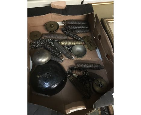 A box of clock weights and other parts 