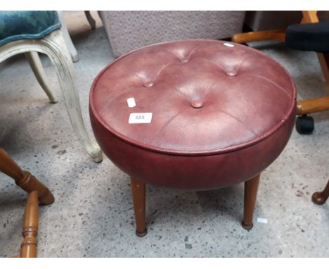 A metal framed and leather seated armchair together with a retro round pouffe 