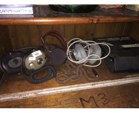 Three vintage pairs of headphones and two microphones 