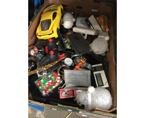 A box of misc items including watches, clock, toys, etc 