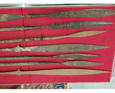 SIX AFRICAN SPEAR SHAFTS, ELEVEN VARIOUS BLADES AND POINTS TOGETHER WITH A KHRIS IN A WOODEN SCABBARD