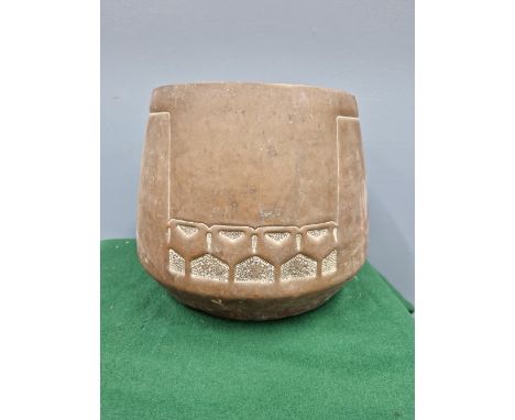 A VIENNA SECESSION STYLE COPPER PLANTER, THE CYLINDRICAL SIDES FLARING TO THREE BANDS OF FIVE SQUARED PEACOCK FEATHER EYES.  