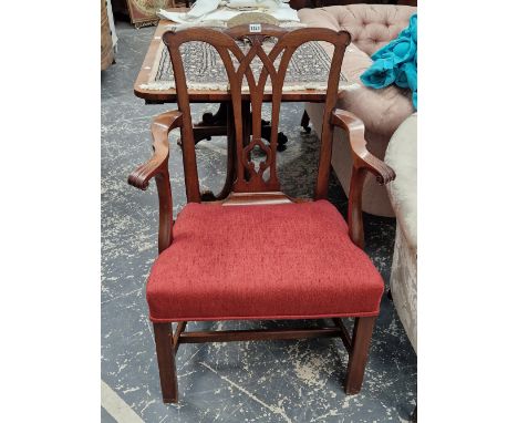 A CARVED MAHOGANY GEORGIAN ARMCHAIR IN THE CHIPPENDALE TASTE