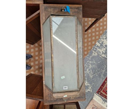 A WALL LIGHT WITH THREE FROSTED GLASS PANELS MOUNTED IN PATINATED COPPER, THE TOP AND BOTTOM FORMED OF THREE METAL PANELS ROU