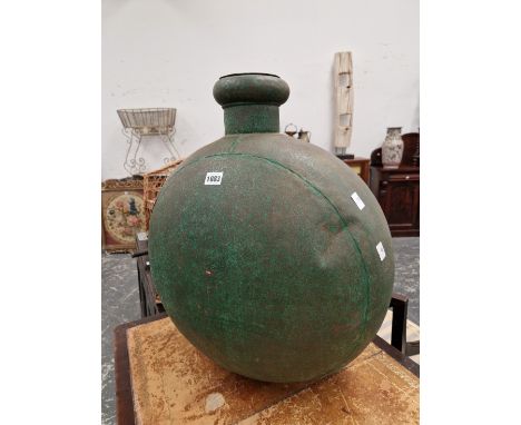 A FLATTENED SPHERICAL GREEN PAINTED METAL FLASK AND COVER