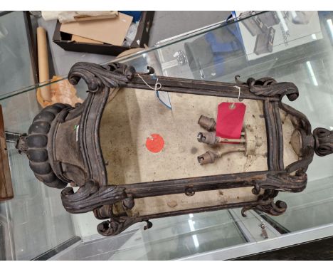 A WALL LIGHT IN HALF LANTERN FORM, THE GADROONED TOP ABOVE FOUR SCROLL TOPPED BARS, A BUD FINIAL FORMING THE BASE, EX SOANE B