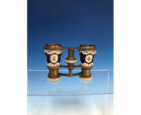 A PAIR OF OPERA GLASSES WITH JEWELLED ENAMEL FLORAL BARRELS GILT WITH STARS ON A ROYAL BLUE GROUND