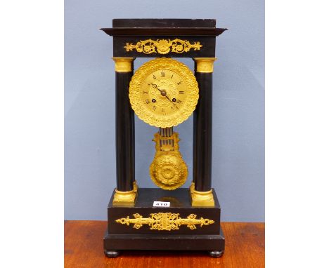 A 19th C. FRENCH EBONY AND ORMOLU PORTICO CLOCK, THE MOVEMENT WITH COMPENSATED PENDULUM AND COUNTWHEEL STRIKING ON A BELL.   