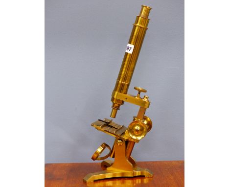 A HUSBANDS AND CLARKE, BRISTOL BRASS MONOCULAR MICROSCOPE