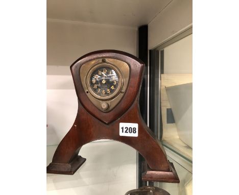A VINTAGE MANUAL WOUND AMERICAN CAR CLOCK, WATERBERRY MOTOR, MOUNTED IN A MAHOGANY STAND. 