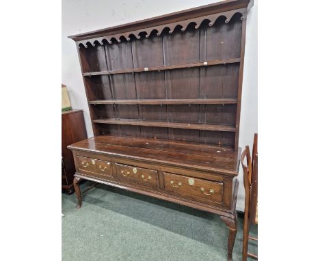 A 19th C. AND LATER OAK DRESSER WITH AN ENCLOSED THREE SHELF BACK AND WITH THREE DRAWERS TO THE BASE ON CABRIOLE FRONT LEGS. 