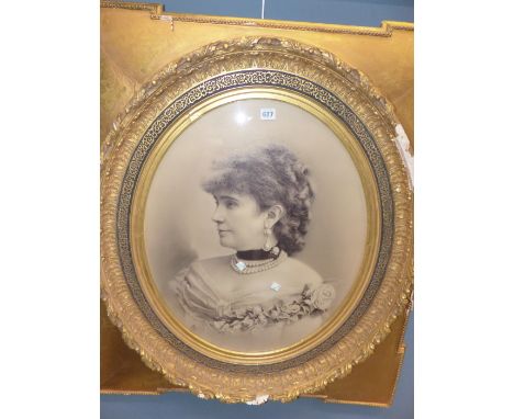 A LATE 19th C. OVAL PHOTOGRAPHIC PORTRAIT OF A LADY WITHIN A RECTANGULAR GILT FRAME.   98 x 87cms.