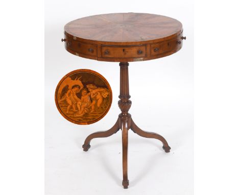 A 19th century revolving drum top table, veneered in satinwood, the top with a central panel decorated cherubs, the frieze wi