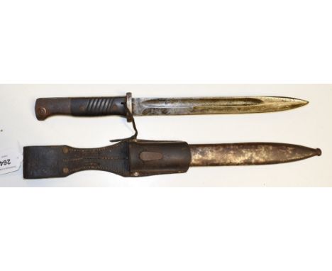 EXTRA LOT: A German bayonet and scabbard, the leather mount stamped Sachs & Deisselberg Hamburg 1934, overall length 41 cm 