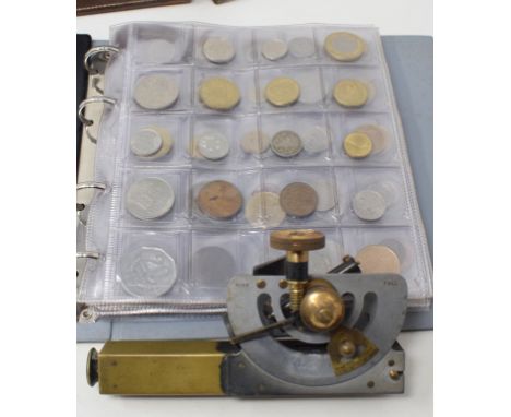 A JH Steward clinometer, 16 cm, in leather case and two albums of assorted coins 