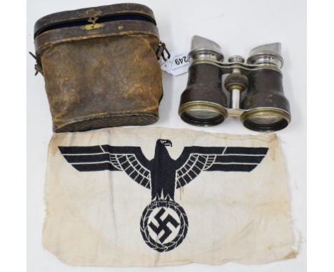 A German Third Reich pennant, with an eagle above a swastika, approx. 25.5 cm wide, and a pair of field glasses, inset a comp
