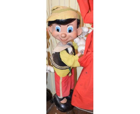 A large Pelham Puppet shop display Pinocchio puppetReport by RBOne finger broken off 