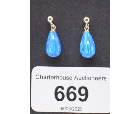 A pair of 9ct gold and gilson black opal teardrop earrings 