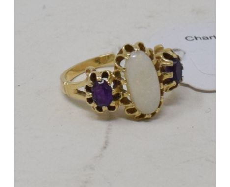 A 14ct gold, white opal and amethyst three stone ring, approx. ring size P½ 