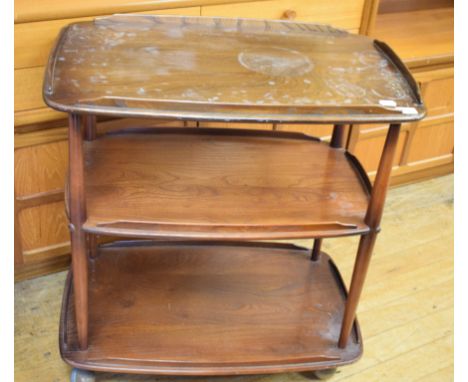 An Ercol elm three tier trolley, 70 cm wide, an oak chest of drawers, and a dressing mirror (3) 