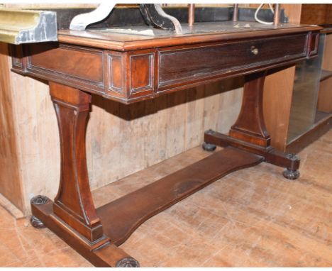 A Victorian mahogany writing table, adapted, 137 cm wide, an armchair, a Pembroke table, a brass fender and other occasional 