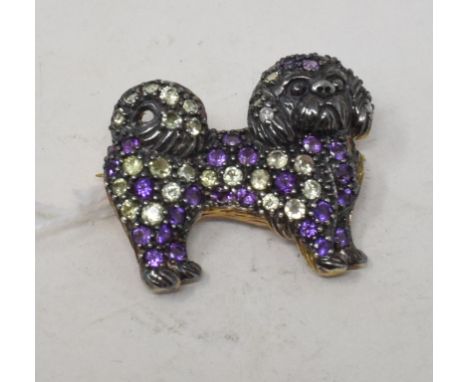 A 9ct gold, silver, amethyst and peridot dog brooch 