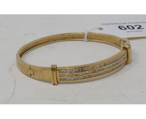 An 18ct gold and diamond hinge bangle, the diamonds approx. 1.50ct 