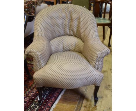 A late 19th century button back armchair, on cabriole front legs 