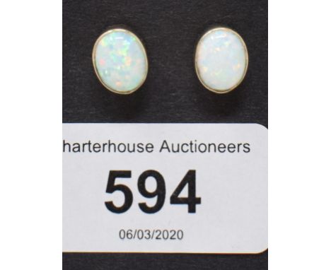 A pair of 9ct gold and gilson opal earrings 