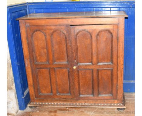 A Victorian oak cupboard, having a pair of panel doors enclosing shelves, 114 cm wideReport by PMInside depth - 29.5 cm, shel