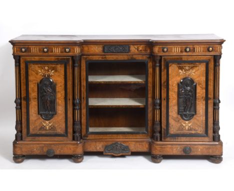 A Victorian credenza, of inverted breakfront form, veneered in walnut and burr walnut, and applied panels decorated figures, 