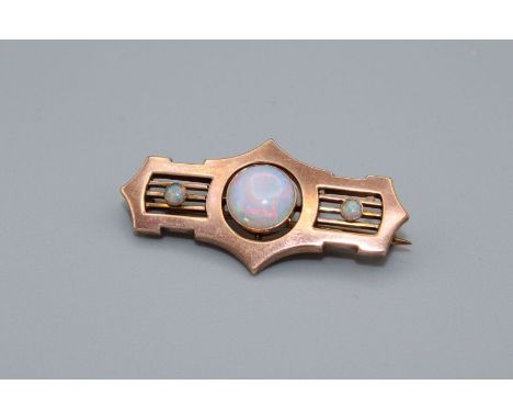 A pinkish yellow metal Art Deco opal set brooch. Stamped "9.ct" to the reverse and in a fitted Collingwood &amp; Son, Sunderl