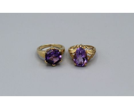 Two Amethyst cocktail rings in 9ct gold. The first a fancy cut Octagonal shaped Amethyst ring, the amethyst an estimated 5.02