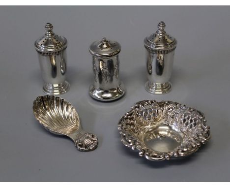 A selection of sterling silver table wares. Comprising a pair of George V pepperettes, hallmarked for Ernest W Hayward, Birmi