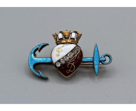 A Child & Child Guilloche enamel and diamond set crowned heart and anchor brooch. The heart features the initials "F" and "D"