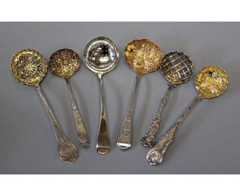 A selection of six Georgian later sugar sifters and fruit spoons. To include a sugar sifting spoon, marked for Stephen Adams 