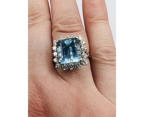 An Aquamarine and diamond cocktail ring in 18ct white gold. Aquamarine an estimated 4.9ct, loupe clean 0.8ct of surrounding d