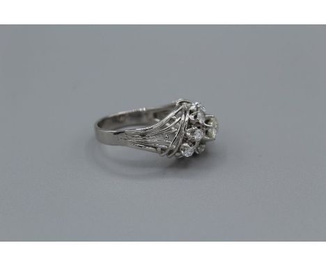 A raised setting spiral design 1.05 carat diamond ring. Featuring an old mine cut ring set in a raised wire made design.With 