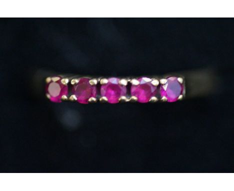 Yellow metal ring set with rubies Size N