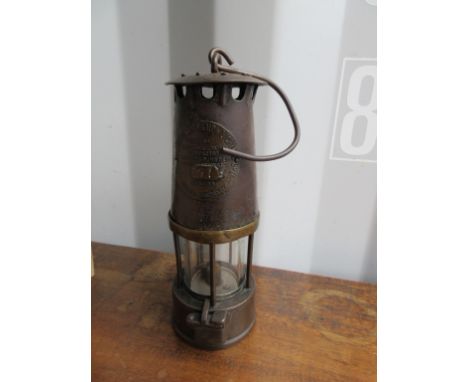 A vintage metal Lamp, Prestwichs Patent Protector Lamp, approx height 10''.