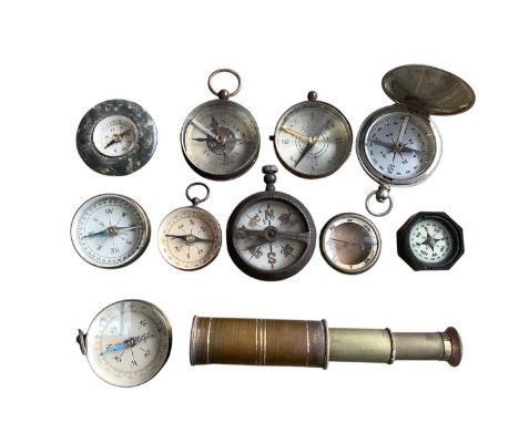 Group of various pocket compasses and a small brass telescope