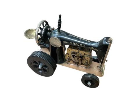 Unusual steampunk 'tractor' with working pistons, made from a Singer sewing machine and clock movement, with rubber tyres