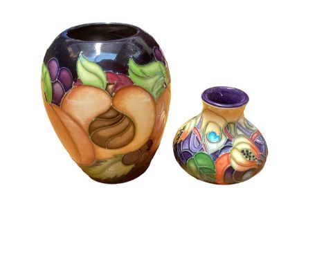 Moorcroft pottery vase decorated in the Pomegranate Reborn pattern, dated 2009, together with another decorated in the Celtic