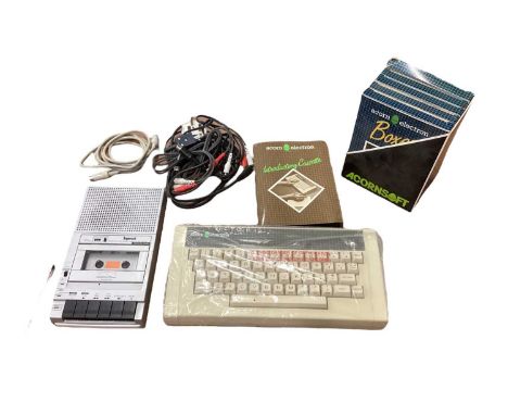 Acorn electron computer in original box with introductory cassette, user guide, four original Acornsoft games in original box