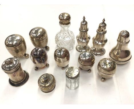 Collection of silver and silver mounted salt and pepper pots276 grams of silver