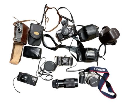 Collection of cameras and accessories, including an Olympus OM-2N and lenses, Mamiya, Yashica, etc plus a folder of instructi