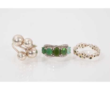 Three contemporary silver (925) dress rings to include a silver ball torque ring, adjustable size, abstract circle ring, size