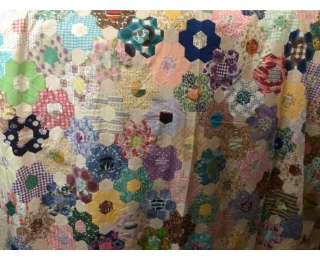 Two mid-century patchwork quilts in Grandmother's Flower Garden design, patches include Bill and Ben, Sooty and Sweep, Tweety